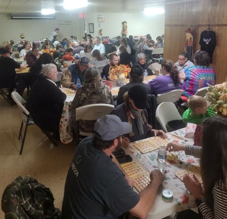 Community members gathering for bingo at GG's House