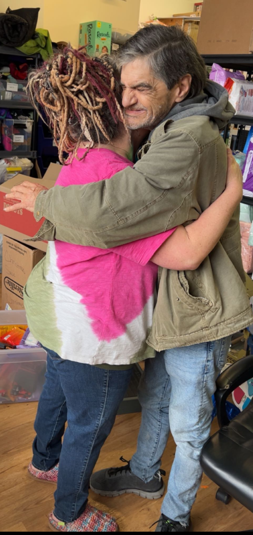 Angel embracing a man at GG's House