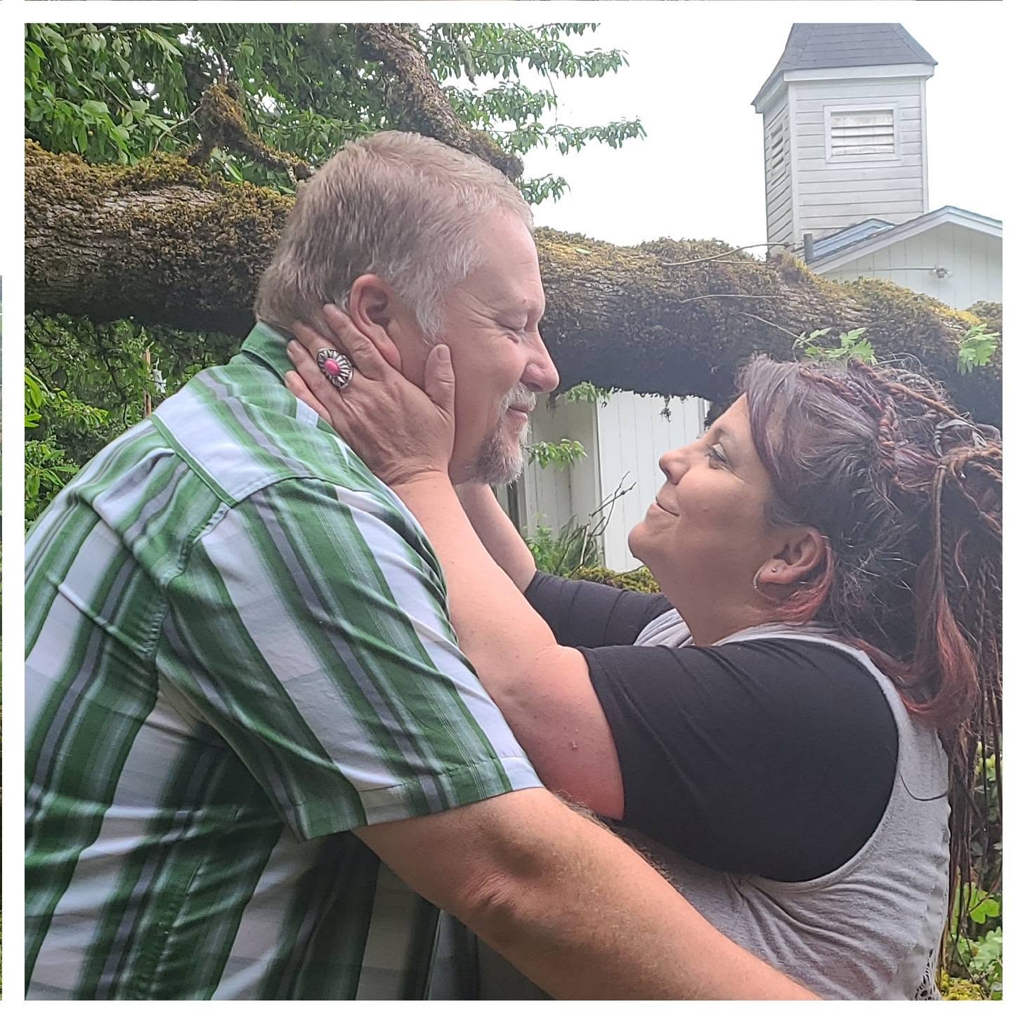 Steve and Angel embracing outside their church