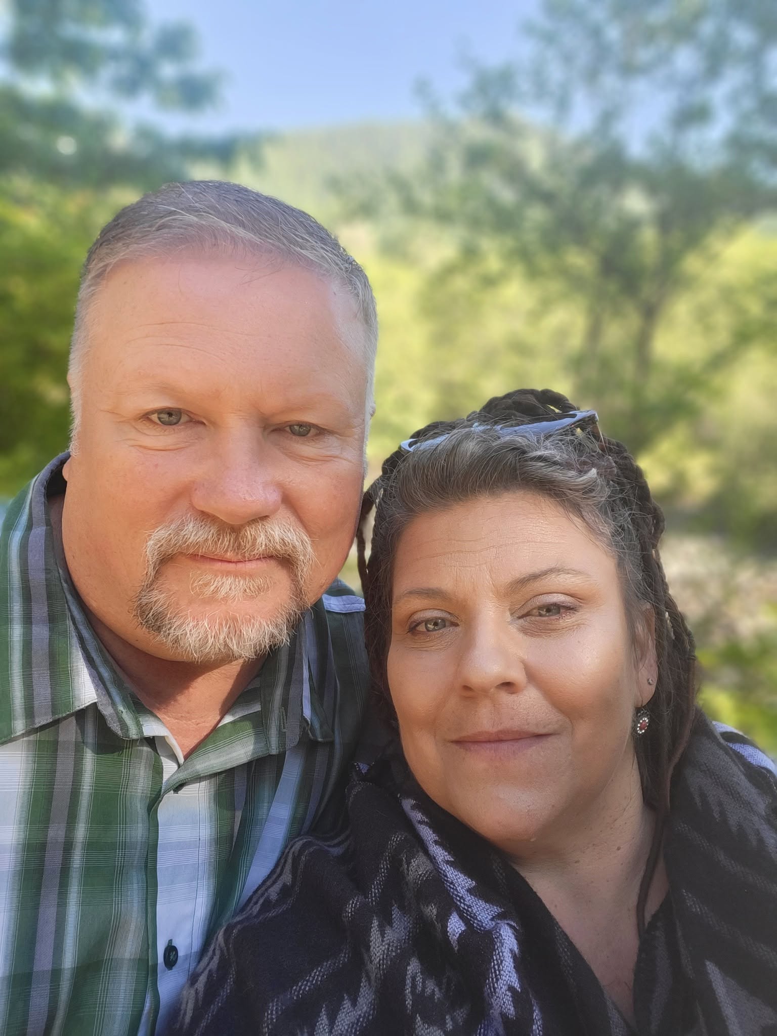 Steve and Angel standing together outdoors
